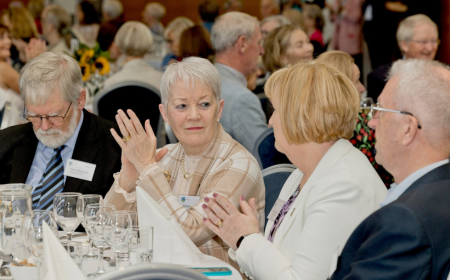 UCD Alumni Golden and Diamond Jubilee Reunion attendees engaged in conversation.
